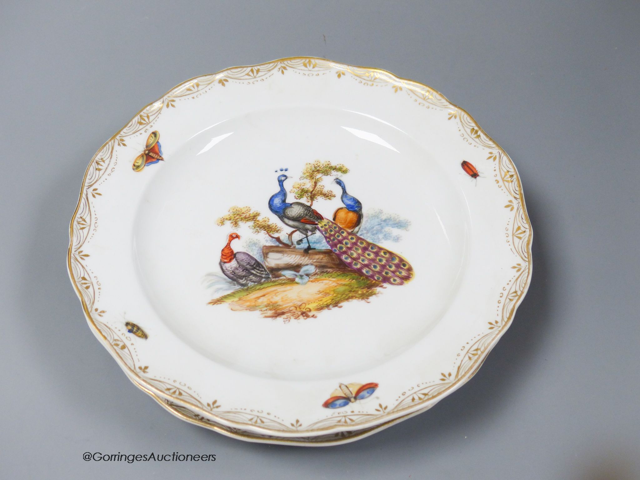 A set of six Meissen dessert dishes, painted with birds,factory seconds, 25.5cm diameter